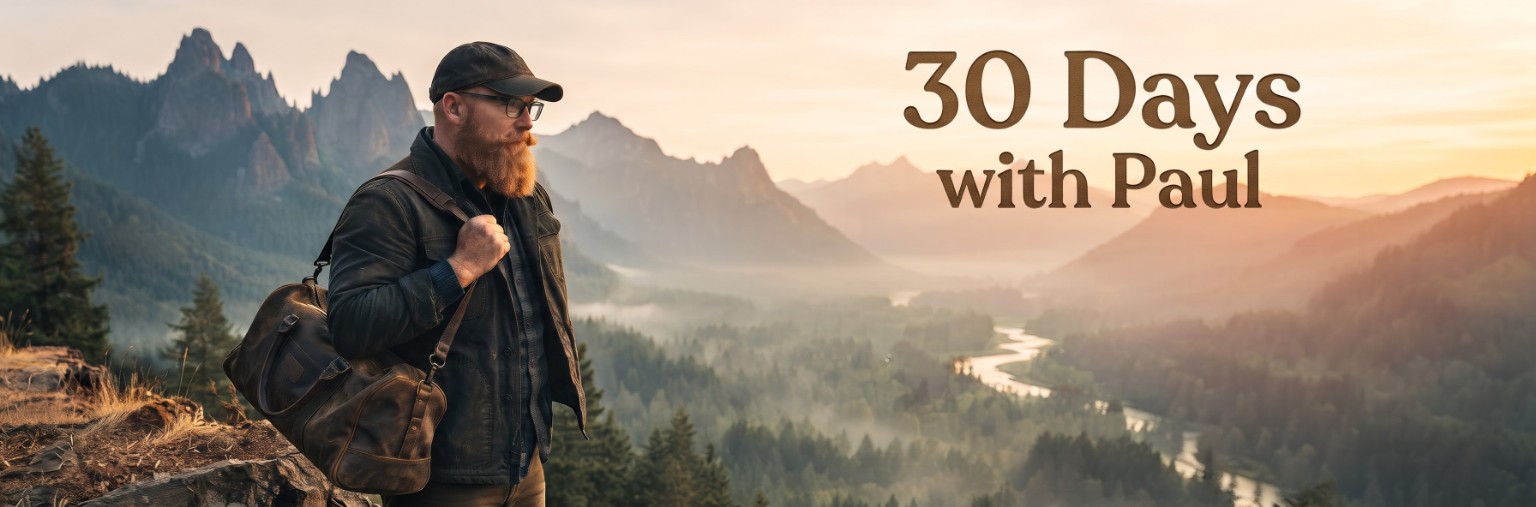 A bearded man in a dark cap standing above a mountain valley at sunrise, with the title 30 Days with Paul.